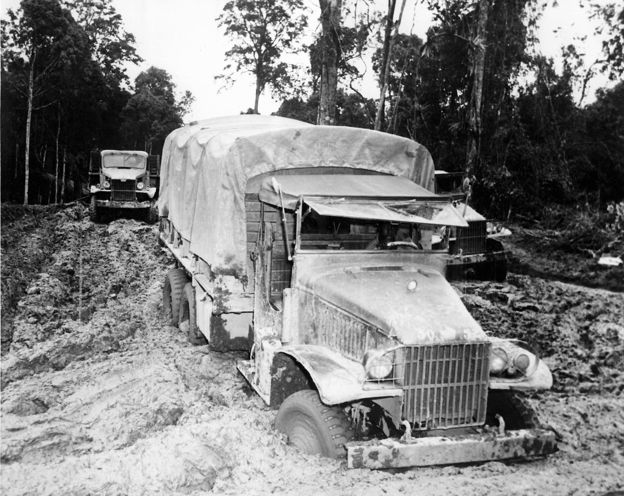 A military truck stuck in mud as an illustration of supply and logistics friction.